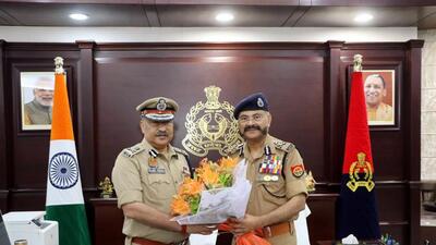 New UP Director General of Police Rajeev Krishna, left, with outgoing DGP Prashant Kumar after he assumed charge of the office, in Lucknow on Saturday. (PTI PHOTO) New UP Director General of Police Rajeev Krishna, left, with outgoing DGP Prashant Kumar after he assumed charge of the office, in Lucknow on Saturday. (PTI PHOTO)