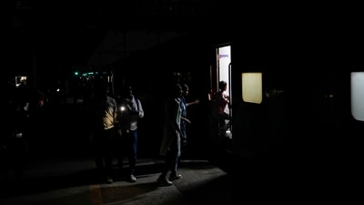 Commuters on roads and railway stations made their way through the dark during the blackout in Amritsar. Mock drills had been previously held in several states on May 7, following the Pahalgam terror attack. (PTI)