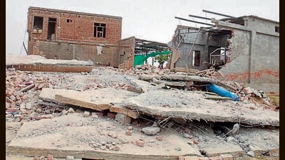 The explosion razed a two-storey structure located at Fatuhiwala village in Muktsar on Friday. (Sanjeev Kumar/HT)