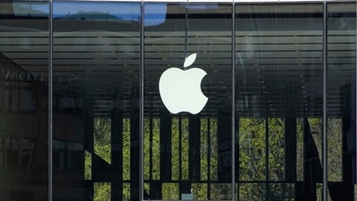 FILE - People sit in front of an Apple Store in Duesseldorf, Germany, Monday, April 7, 2025. (AP Photo/Martin Meissner, File) (AP) FILE - People sit in front of an Apple Store in Duesseldorf, Germany, Monday, April 7, 2025. (AP Photo/Martin Meissner, File) (AP)