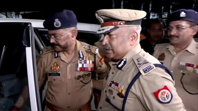 Newly appointed Uttar Pradesh Director General of Police (DGP), Rajeev Krishna (right), with outgoing State DGP Prashant Kumar (left), in Lucknow on Saturday. (ANI Grab )
