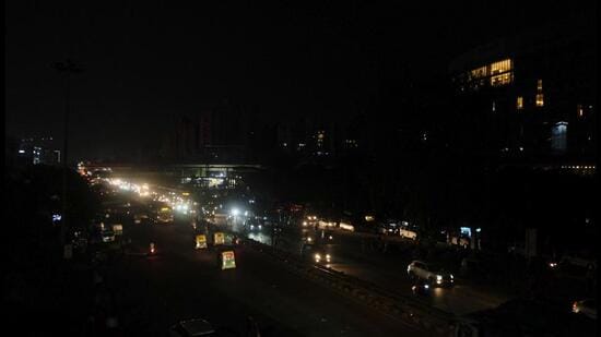 Vehicles move on a road during the blackout drill, in Gurugram on Saturday. (PTI)