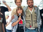 Climate activist Greta Thunberg interacts with journalists in Catania, Italy, on Sunday, June 1, 2025, ahead of their departure for the Mideast. 