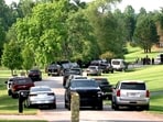 In this image taken from WSOC video, various police vehicles gather outside a community after a mass shooting, Sunday, June 1, 2025, in Hickory, a city in Catawba County, N.C. In this image taken from WSOC video, various police vehicles gather outside a community after a mass shooting, Sunday, June 1, 2025, in Hickory, a city in Catawba County, N.C.