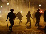 Riot police on the Champs Elysees avenue after Paris St Germain's Champions League win caused clashes. 