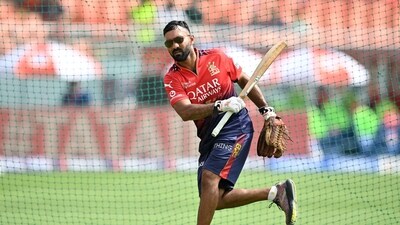 Royal Challengers Bengaluru's batting coach Dinesh Karthik bats in nets ahead of the Indian Premier League (IPL) Twenty20 cricket match between Punjab Kings and Royal Challengers Bengaluru (AFP) Royal Challengers Bengaluru's batting coach Dinesh Karthik bats in nets ahead of the Indian Premier League (IPL) Twenty20 cricket match between Punjab Kings and Royal Challengers Bengaluru (AFP)