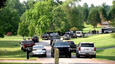 In this image taken from WSOC video, various police vehicles gather outside a community after a mass shooting, Sunday, June 1, 2025, in Hickory, a city in Catawba County, N.C. (WSOC via AP)