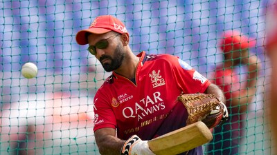 Nasser Hussain and Michael Atherton joked Dinesh Karthik would be unbearable if RCB end their trophy drought (PTI) Nasser Hussain and Michael Atherton joked Dinesh Karthik would be unbearable if RCB end their trophy drought (PTI)