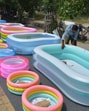 A vendor adjusts his display of paddling pools for sale on the roadside during a hot summer day in Amritsar on Sunday. (Sameer Sehgal/Hindustan Times) A vendor adjusts his display of paddling pools for sale on the roadside during a hot summer day in Amritsar on Sunday. (Sameer Sehgal/Hindustan Times)