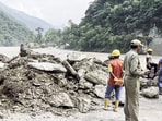 Restoration work underway, as the Phidang Bailey Bridge is partially damaged due to the current of the Teesta River, following heavy rainfall in the region, at Dzongu in North Sikkim on Sunday