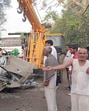 The mangled remains of the car after it rammed into the truck near Unhani village in Mahendergarh early on Monday. (HT Photo)