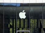 FILE - People sit in front of an Apple Store in Duesseldorf, Germany, Monday, April 7, 2025. (AP Photo/Martin Meissner, File) FILE - People sit in front of an Apple Store in Duesseldorf, Germany, Monday, April 7, 2025. (AP Photo/Martin Meissner, File)