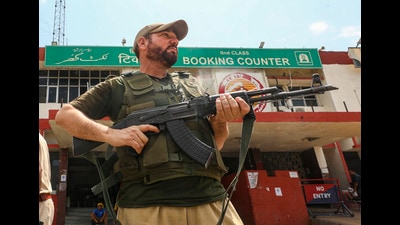 A security personnel stand guard at Jammu railway station after the bomb threat in Jammu on Monday. (PTI) A security personnel stand guard at Jammu railway station after the bomb threat in Jammu on Monday. (PTI)