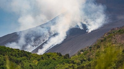 Smoke rises from the crater of the Etna volcano as it erupts, on Mount Etna near Catania on June 2, 2025. A huge plume of ash, gas and rock spewed forth on June 2, 2025, from Italy's Mount Etna, Europe's largest active volcano, after a portion of its southeastern crater likely collapsed, authorities said. (Photo by Giuseppe Distefano / AFP) (AFP) Smoke rises from the crater of the Etna volcano as it erupts, on Mount Etna near Catania on June 2, 2025. A huge plume of ash, gas and rock spewed forth on June 2, 2025, from Italy's Mount Etna, Europe's largest active volcano, after a portion of its southeastern crater likely collapsed, authorities said. (Photo by Giuseppe Distefano / AFP) (AFP)