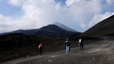 Tourists tour Mount&nbsp;Etna after its eruption this morning, Sicily, Italy, June 2, 2025. Shocking&nbsp;videos&nbsp;that went viral on social media showed frightened tourists running down a trail on the massive volcano's slope as soon as the lava began to overflow. (REUTERS)