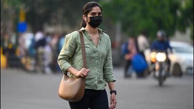People step out wearing face masks amid a resurgence of the Covid-19 outbreak. (Sunil Ghosh/ HT Photo) People step out wearing face masks amid a resurgence of the Covid-19 outbreak. (Sunil Ghosh/ HT Photo)