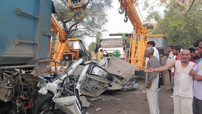 The mangled remains of the car after it rammed into the truck near Unhani village in Mahendergarh early on Monday. (HT Photo)