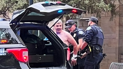 Law enforcement officers detain a suspect, after an attack that injured multiple people, in Boulder, Colorado, U.S. June 1, 2025, in this picture obtained from social media. (X/@OpusObscuraX/via REUTERS) (X/@OpusObscuraX via REUTERS)
