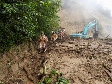ITBP personnel trek through tough terrain to deliver food supplies to stranded civilians at Tachor Potu, NH-13, Arunachal Pradesh, following heavy rains, landslides. (@ITBP_official)