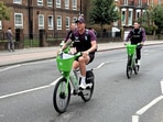 England's Harry Brook, Brydon Carse and Matthew Potts arrive on bicycles before the match 