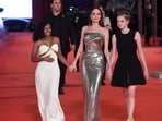 Angelina Jolie arrives with her daughters Zahara (L) and Shiloh (R).