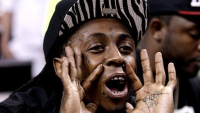 Rapper Lil Wayne shouts during the second half of Game 5 between the Boston Celtics and Miami Heat in their NBA basketball Eastern Conference finals playoffs series in Miami. AP/Lynne Sladky Rapper Lil Wayne shouts during the second half of Game 5 between the Boston Celtics and Miami Heat in their NBA basketball Eastern Conference finals playoffs series in Miami. AP/Lynne Sladky