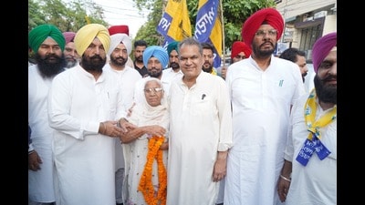 AAP candidate MP Arora during the foot march in Ludhiana on Tuesday. (HT Photo)