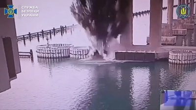 This video grab taken from a handout footage released by the Ukrainian Security Service shows the explosion of the Kerch Bridge connecting Crimea with Russia (AFP)