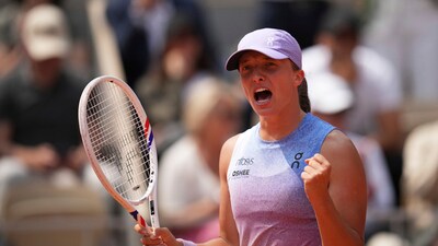 Poland's Iga Swiatek celebrates as she won the quarterfinal match of the French Tennis Open against Ukraine's Elina Svitolina at the Roland Garros (AP) Poland's Iga Swiatek celebrates as she won the quarterfinal match of the French Tennis Open against Ukraine's Elina Svitolina at the Roland Garros (AP)