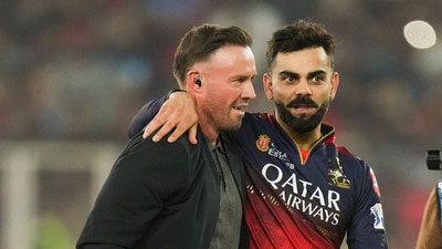 Royal Challengers Bengaluru's Virat Kohli being congratulated by former cricketer AB de Villiers after winning the IPL title (PTI) Royal Challengers Bengaluru's Virat Kohli being congratulated by former cricketer AB de Villiers after winning the IPL title (PTI)