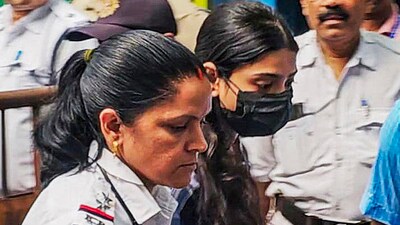 Social media influencer Sharmishta Panoli, who was arrested by the Kolkata Police for making alleged communal comments in a video, being produced at a court, in Kokata, Saturday. (PTI) Social media influencer Sharmishta Panoli, who was arrested by the Kolkata Police for making alleged communal comments in a video, being produced at a court, in Kokata, Saturday. (PTI)