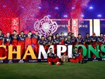 RCB players celebrate lifting the first IPL trophy in franchise history.