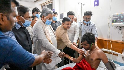 Karnataka chief minister Siddaramaiah meets a person who got injured in the Bengaluru stampede. (ANI) Karnataka chief minister Siddaramaiah meets a person who got injured in the Bengaluru stampede. (ANI)