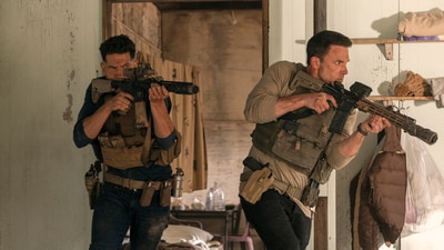 This image released by Amazon shows Jon Bernthal, left, and Ben Affleck in a scene from "The Accountant 2." (AP)