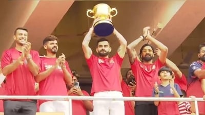 Virat Kohli holds the IPL trophy in front of a packed Chinnaswamy stadium (Screengrab)