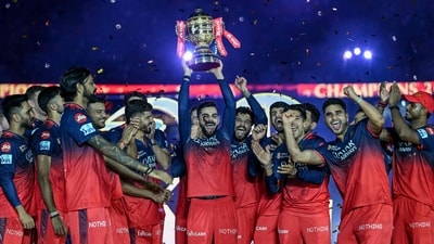 Royal Challengers Bengaluru's Virat Kohli, along with his teammates, celebrates with the trophy after winning the Indian Premier League (IPL) Twenty20 final cricket match against Punjab Kings (AFP) Royal Challengers Bengaluru's Virat Kohli, along with his teammates, celebrates with the trophy after winning the Indian Premier League (IPL) Twenty20 final cricket match against Punjab Kings (AFP)
