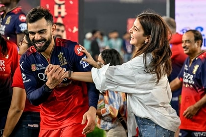 Royal Challengers Bengaluru's Virat Kohli (centre L) celebrates along with his wife and actress Anushka Sharma (centre R) after winning the Indian Premier League (IPL) against Punjab Kings at the Narendra Modi Stadium in Ahmedabad on June 4, 2025. (Photo by Arun SANKAR / AFP) (AFP) Royal Challengers Bengaluru's Virat Kohli (centre L) celebrates along with his wife and actress Anushka Sharma (centre R) after winning the Indian Premier League (IPL) against Punjab Kings at the Narendra Modi Stadium in Ahmedabad on June 4, 2025. (Photo by Arun SANKAR / AFP) (AFP)