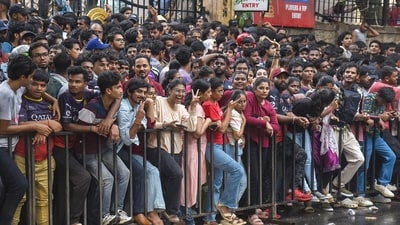 Fans gather outside the M Chinnaswamy Stadium to celebrate Royal Challengers Bengaluru winning the IPL in Bengaluru. (AFP) Fans gather outside the M Chinnaswamy Stadium to celebrate Royal Challengers Bengaluru winning the IPL in Bengaluru. (AFP)