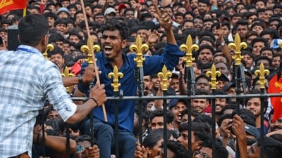 Fans wave flags as thousands gather outside the Vidhana Soudha to celebrate with Royal Challengers Bengaluru players winning the Indian Premier League (IPL), in Bengaluru. (AFP) Fans wave flags as thousands gather outside the Vidhana Soudha to celebrate with Royal Challengers Bengaluru players winning the Indian Premier League (IPL), in Bengaluru. (AFP)