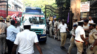 Police officers make way for an ambulance following a stampede at the Chinnaswamy Stadium in Bengaluru, India. (REUTERS)