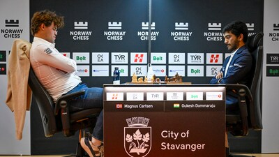 Magnus Carlsen from Norway, left, and Gukesh Dommaraju from India during their game. (AP) Magnus Carlsen from Norway, left, and Gukesh Dommaraju from India during their game. (AP)