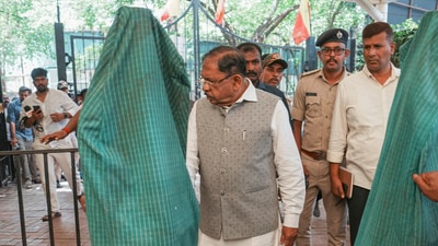 Karnataka Home Minister G Parameshwara with Bengaluru City Commissioner of Police B Dayananda and other police personnel during an inspection after the stampede near the Chinnaswamy stadium that claimed 11 lives, in Bengaluru (PTI)