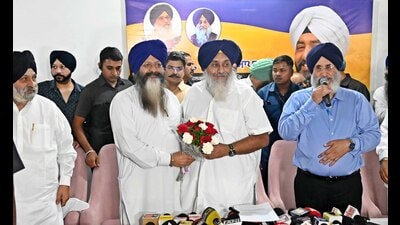 SAD president Sukhbir Badal with former minister Sohan Singh Thandal in Ludhiana on Thursday. (Gurpreet Singh/HT)