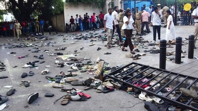 Abandoned shoes and a fallen barrier following a stampede during celebrations organised a day after Royal Challengers Bengaluru's IPL victory. (AFP) Abandoned shoes and a fallen barrier following a stampede during celebrations organised a day after Royal Challengers Bengaluru's IPL victory. (AFP)
