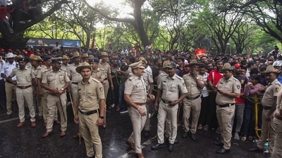 Police stand in front of crowds as fans gather outside the M. Chinnaswamy Stadium to celebrate Royal Challengers Bengaluru winning the Indian Premier League (IPL). (AFP) Police stand in front of crowds as fans gather outside the M. Chinnaswamy Stadium to celebrate Royal Challengers Bengaluru winning the Indian Premier League (IPL). (AFP)