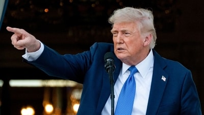 US President Donald Trump on the Truman balcony during a Summer soiree on the South Lawn of the White House in Washington, DC, on Wednesday, (Bloomberg) US President Donald Trump on the Truman balcony during a Summer soiree on the South Lawn of the White House in Washington, DC, on Wednesday, (Bloomberg)