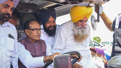 Union agriculture minister Shivraj Singh Chouhan drives a tractor as Punjab agriculture minister Gurmeet Singh Khudian (right) accompanies him to a Kisan Chaupal at Kheri Gandiyan village in Rajpura, Patiala, on Thursday. (PTI Photo) Union agriculture minister Shivraj Singh Chouhan drives a tractor as Punjab agriculture minister Gurmeet Singh Khudian (right) accompanies him to a Kisan Chaupal at Kheri Gandiyan village in Rajpura, Patiala, on Thursday. (PTI Photo)