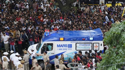 At least 11 people died and more than 40 were injured after a stampede as crowds tried to entered Chinnaswamy Stadium. (AP Photo/Aijaz Rahi) At least 11 people died and more than 40 were injured after a stampede as crowds tried to entered Chinnaswamy Stadium. (AP Photo/Aijaz Rahi)