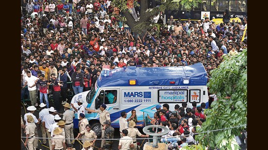 An ambulance arrives at the M. Chinnaswamy Stadium as fans gather to celebrate Royal Challengers Bengaluru cricketers, winners of the Indian Premier League, in Bengaluru. (AP)