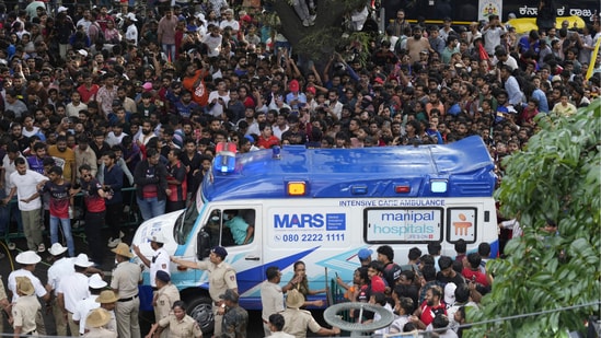 At least 11 people died and more than 40 were injured after a stampede as crowds tried to entered Chinnaswamy Stadium. (AP Photo/Aijaz Rahi)